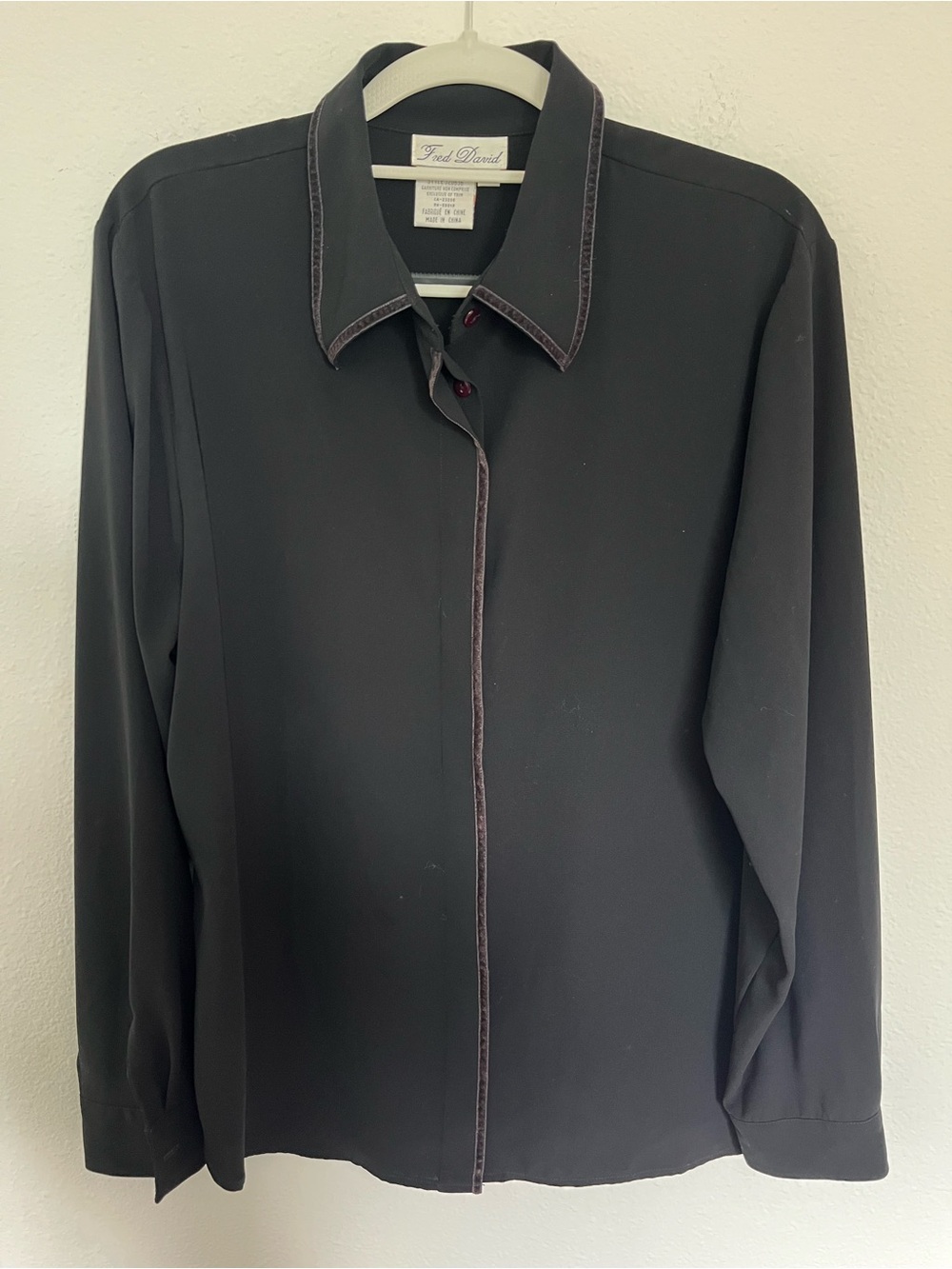 Fred David Black Long Sleeve Blouse with velvet trim and red button detail.